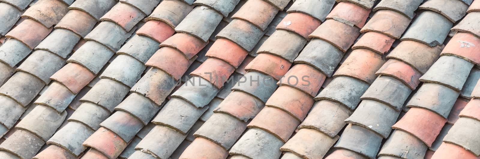 Panoramic colorful curved clay tiled roof from ancient house in the North Vietnam by trongnguyen