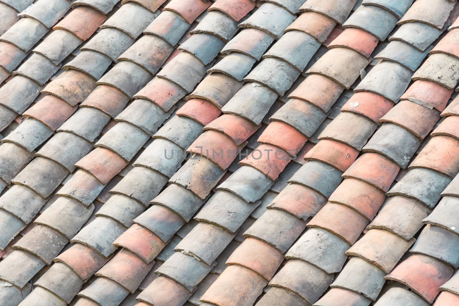 Colorful curved clay tiled roof from ancient house in the North Vietnam by trongnguyen