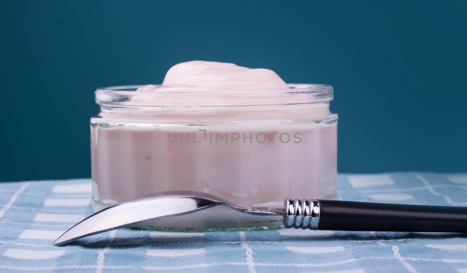 Strawberry yogurt in glass bowl by lanalanglois
