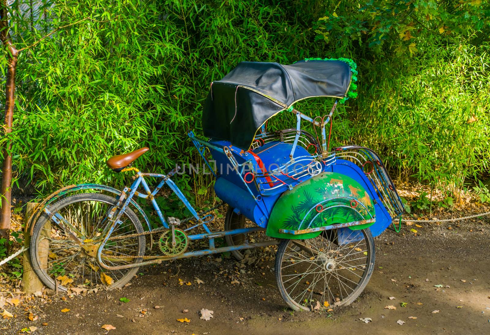 Side view of a traditional Asian cycle rickshaw, Vintage transportation vehicle from Asia