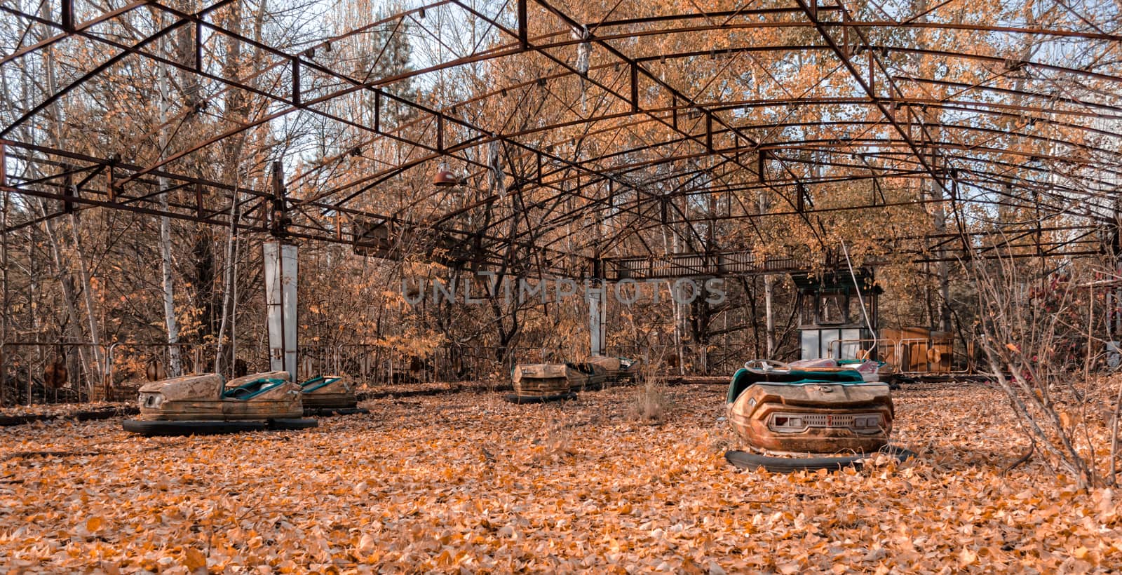 cars in an abandoned amusement park in Chernobyl Ukraine in autumn