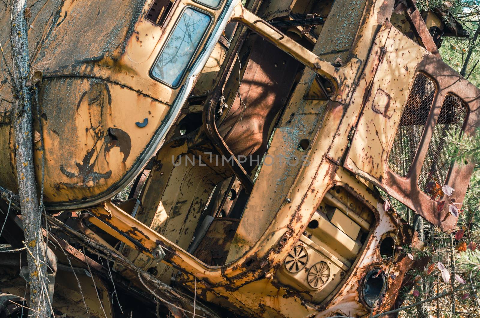 abandoned broken equipment car in the Chernobyl forest Ukraine in autumn