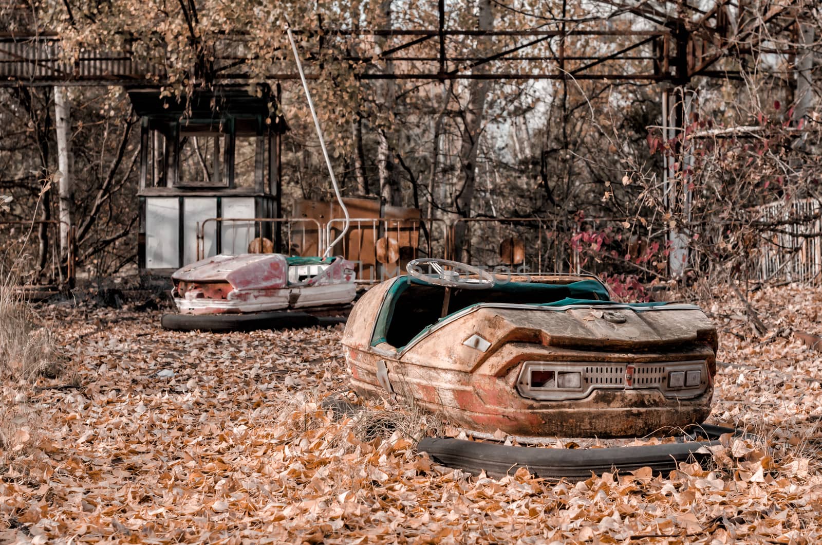 cars and nobody in an abandoned amusement park in Chernobyl Ukraine