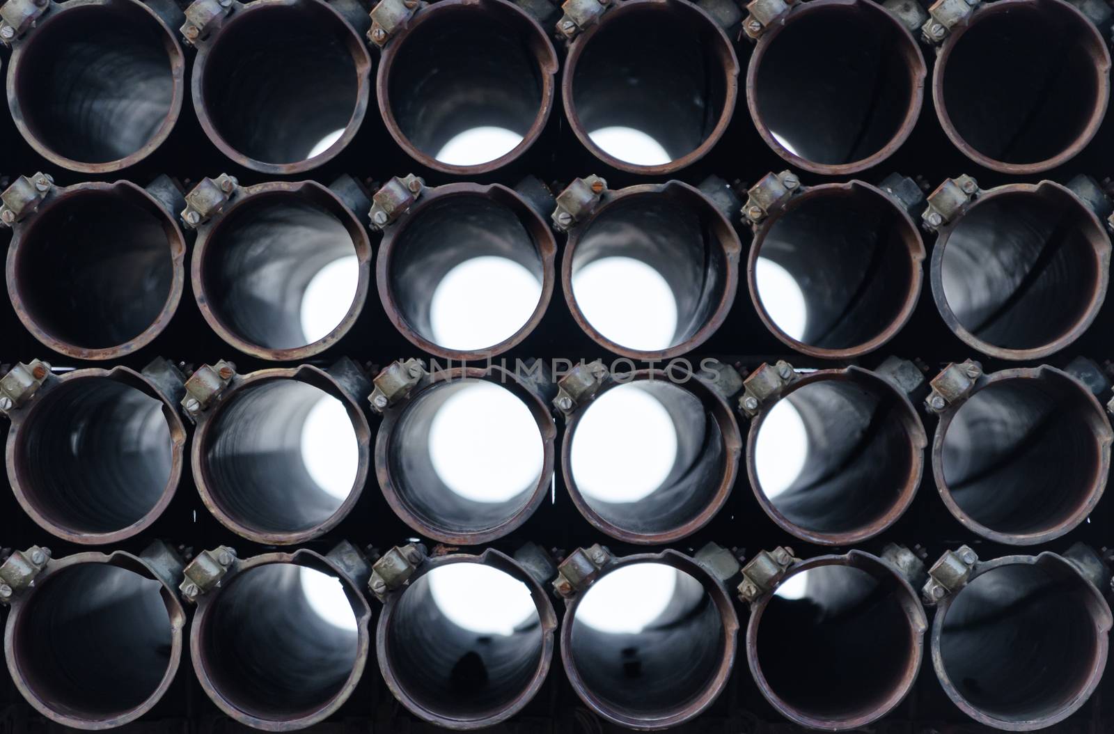 abstract background barrel of an army military rocket launcher close up