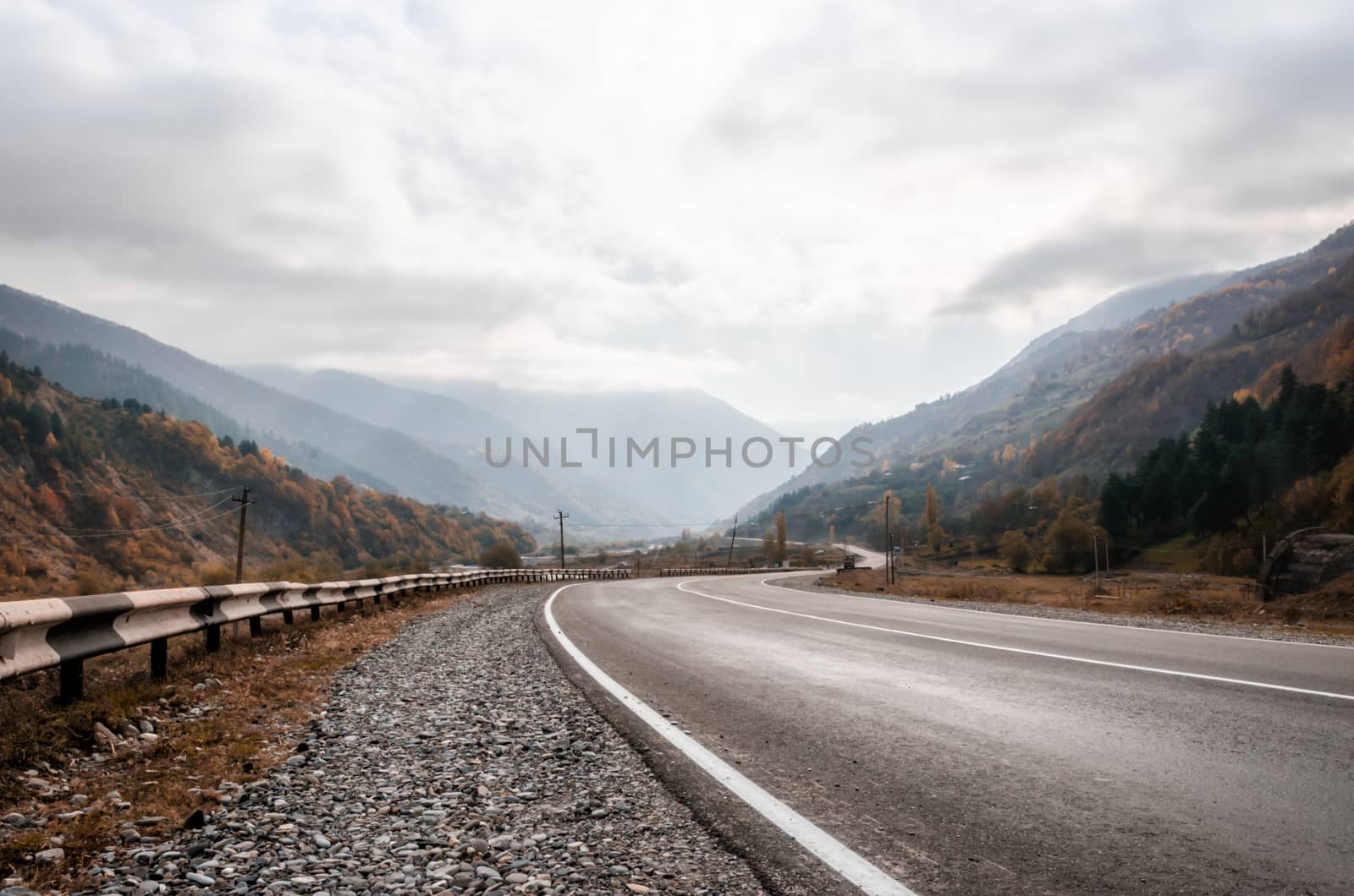 background landscape mountain road and sky with clouds in the afternoon in Georgia in autumn