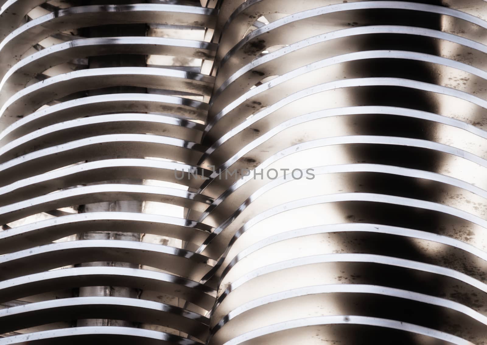 abstract background smooth curved lines metal construction close up