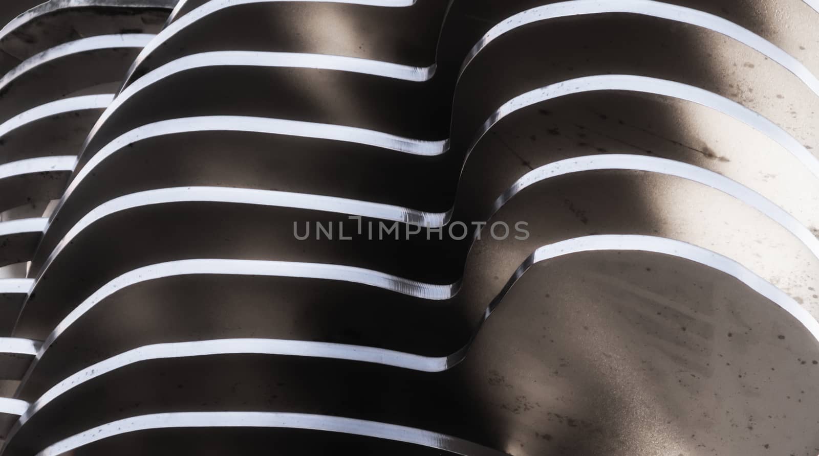 abstract background smooth curved lines metal construction close up