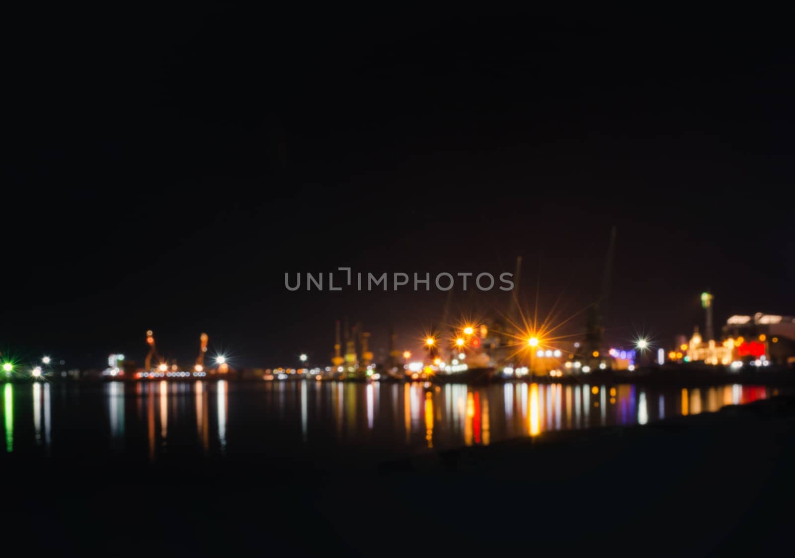 abstract blurred black background with neon light with rays and reflection