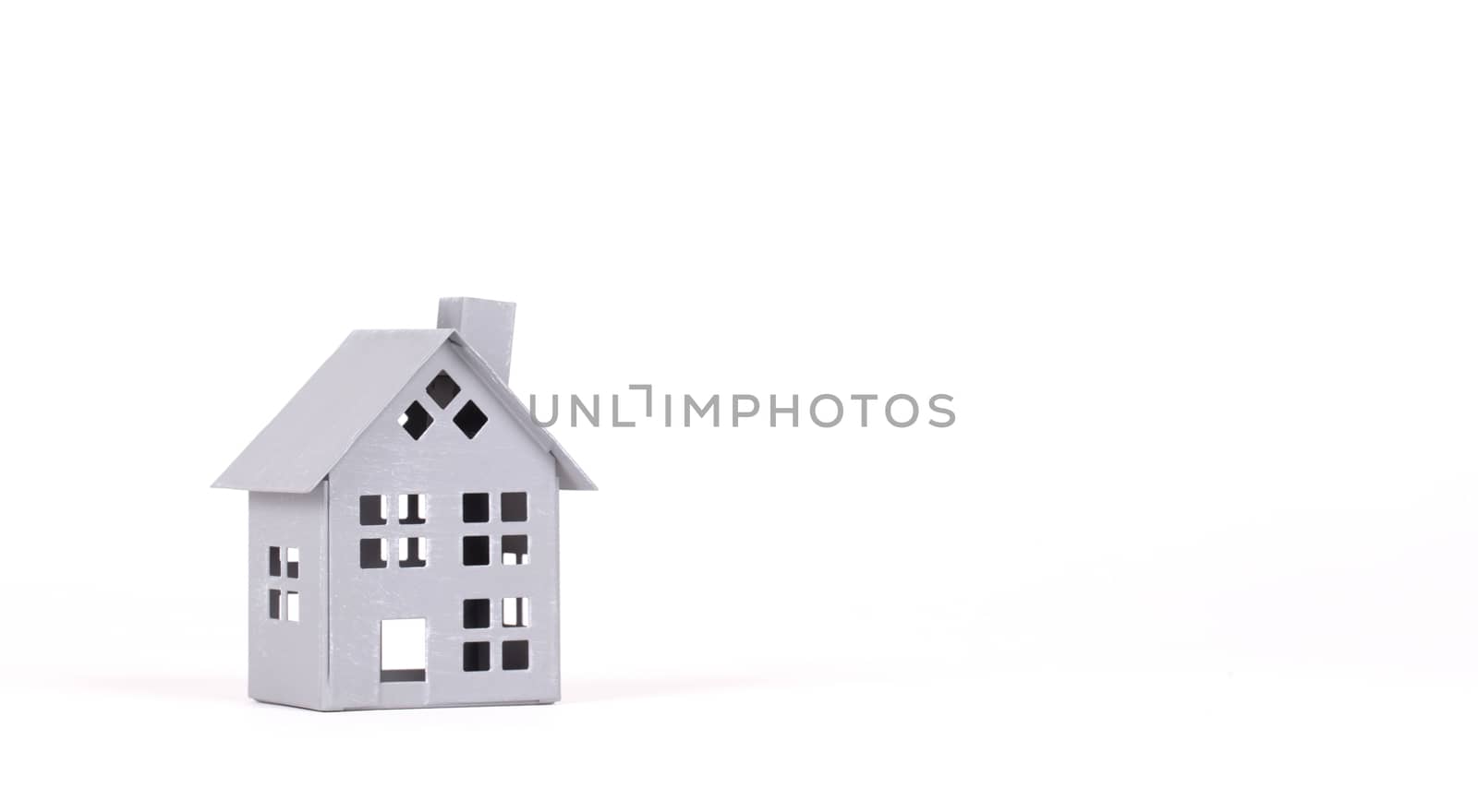 Estate concept, metal house on isolated white background - Idea for real estate concept, personal property and family house