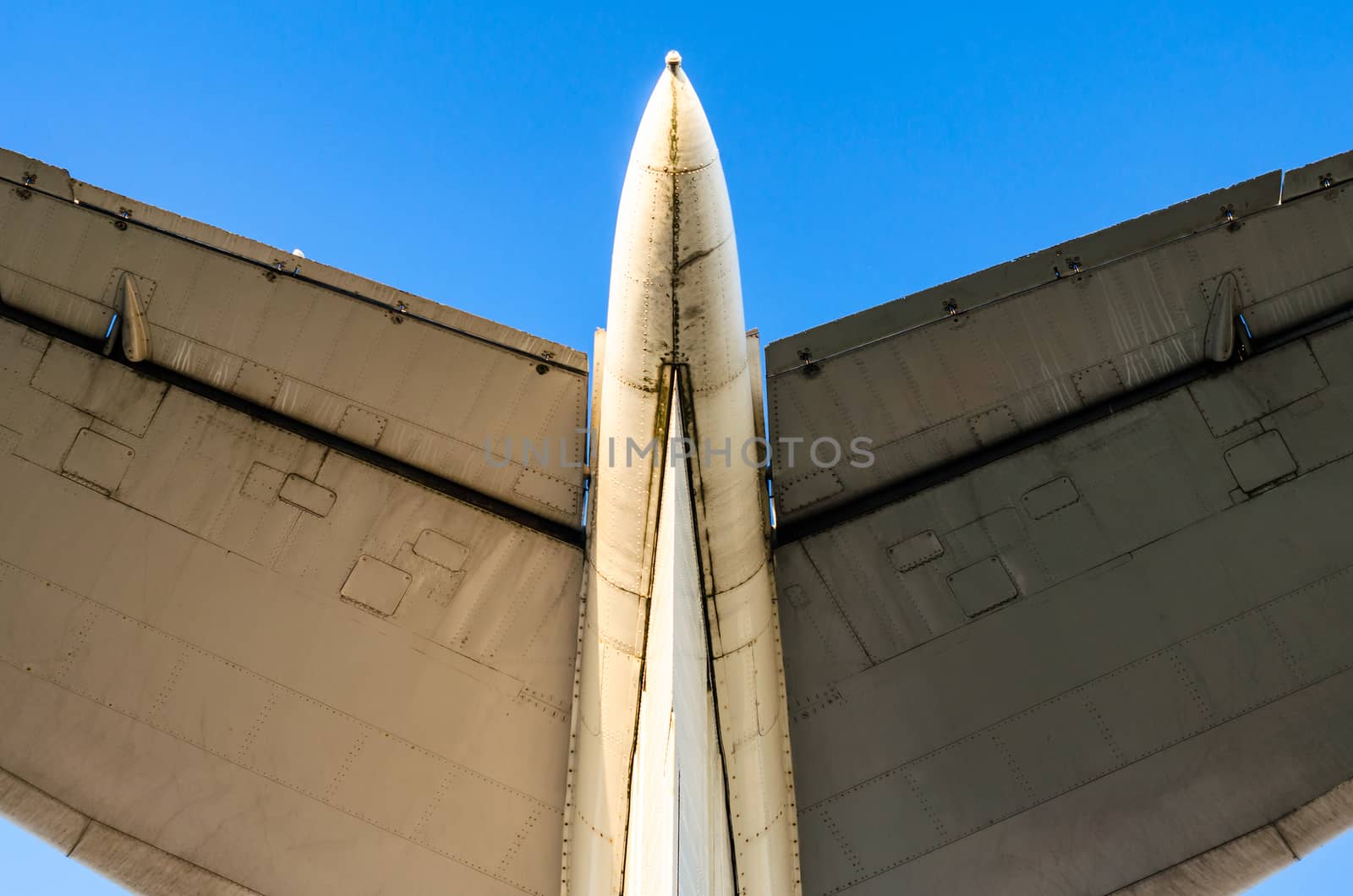 abstract background wings of a large airliner on a blue background isolated
