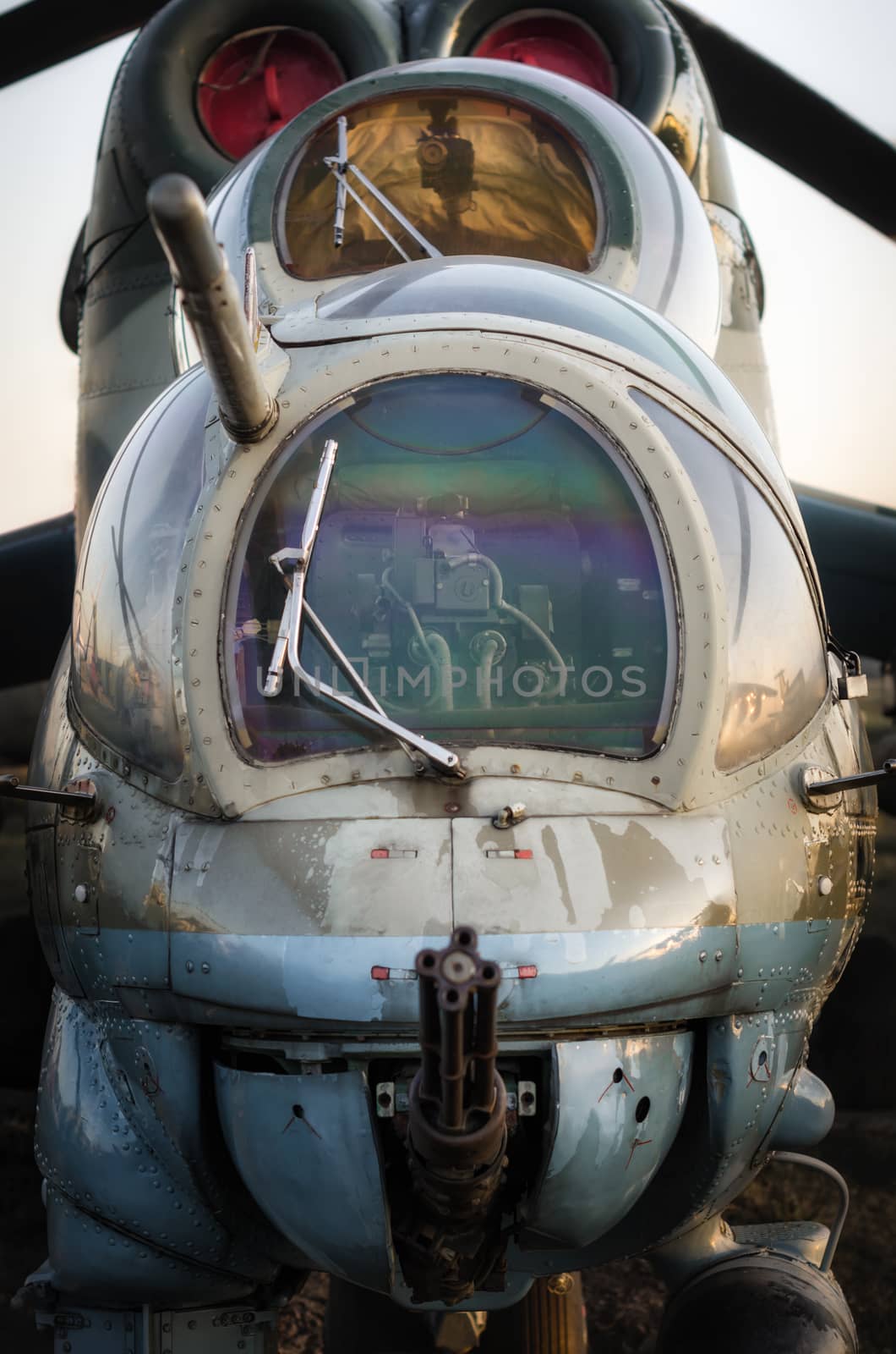 cockpit of a russian army military helicopter with a machine gun closeup