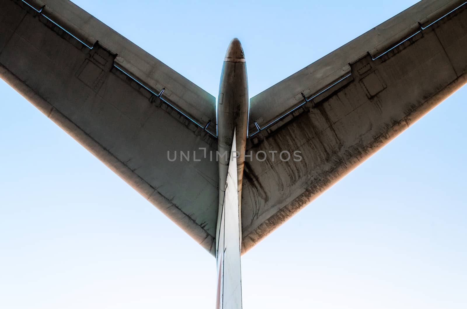 abstract background wings of a large airliner on a blue background isolated