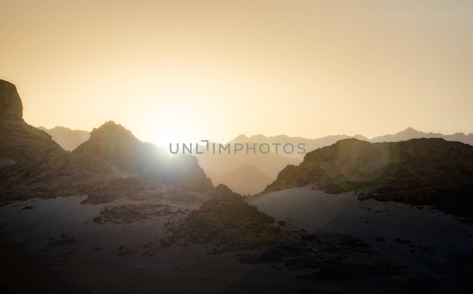 sunset with glare of the sun in the mountains in the desert in Egypt in Sharm El Sheikh