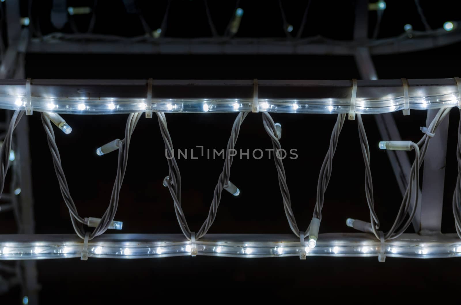 abstract background pattern small lamps on a black background closeup