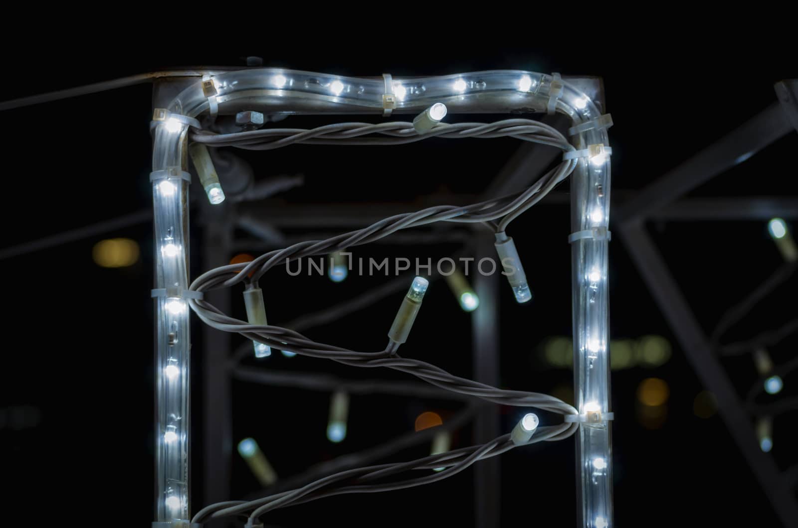 abstract background pattern small lamps on a black background closeup
