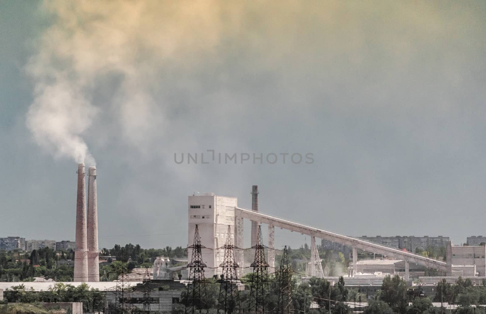 industrial landscape smoke from the chimney of the plant and smog in the sky over the city in Ukraine