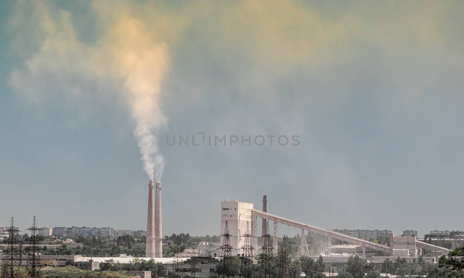 industrial landscape smoke from the chimney of the plant and smog in the sky over the city in Ukraine