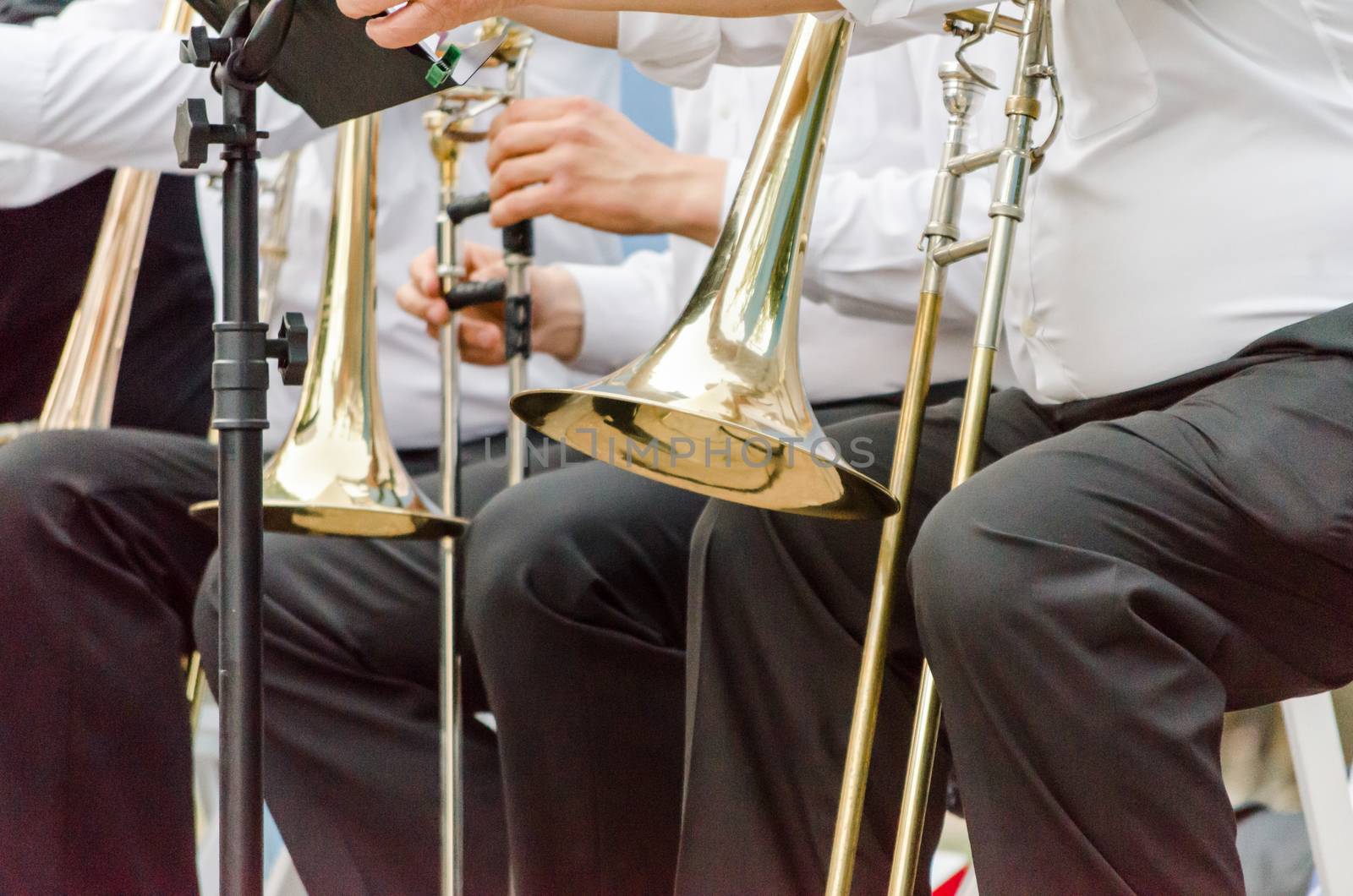 ands and trumpets of symphony orchestra musicians closeup