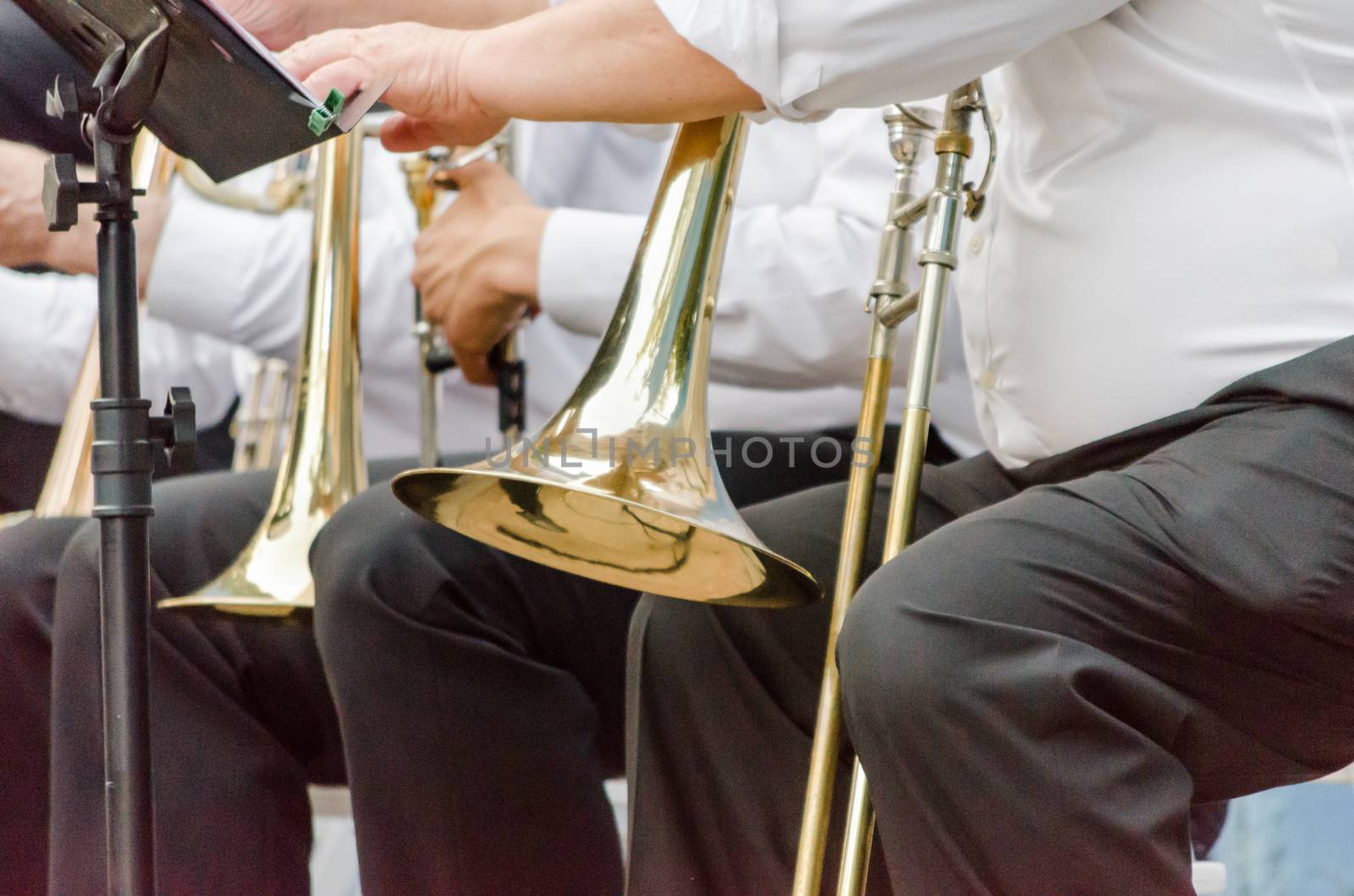 ands and trumpets of symphony orchestra musicians closeup