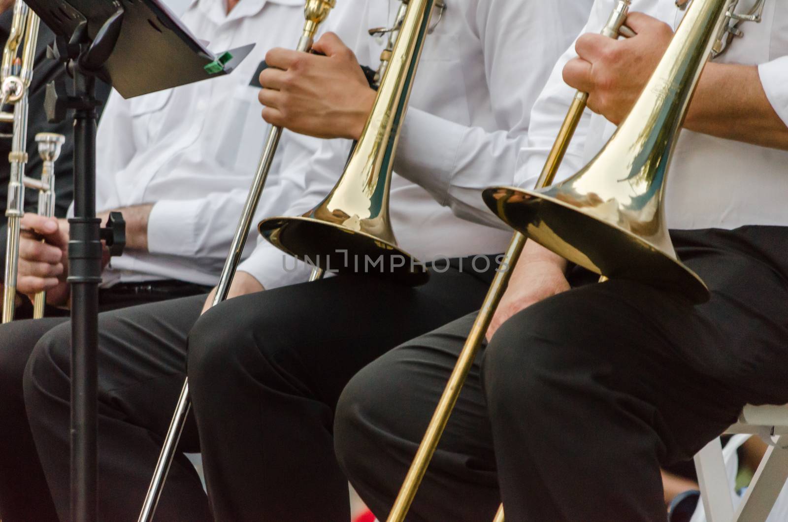 ands and trumpets of symphony orchestra musicians closeup