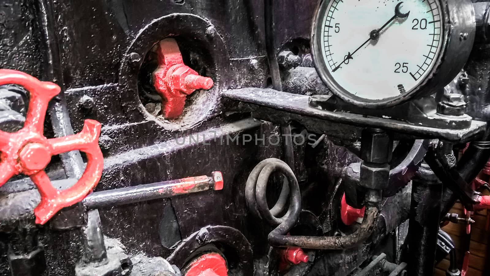 controls and valves in the cabin of an old steam locomotive