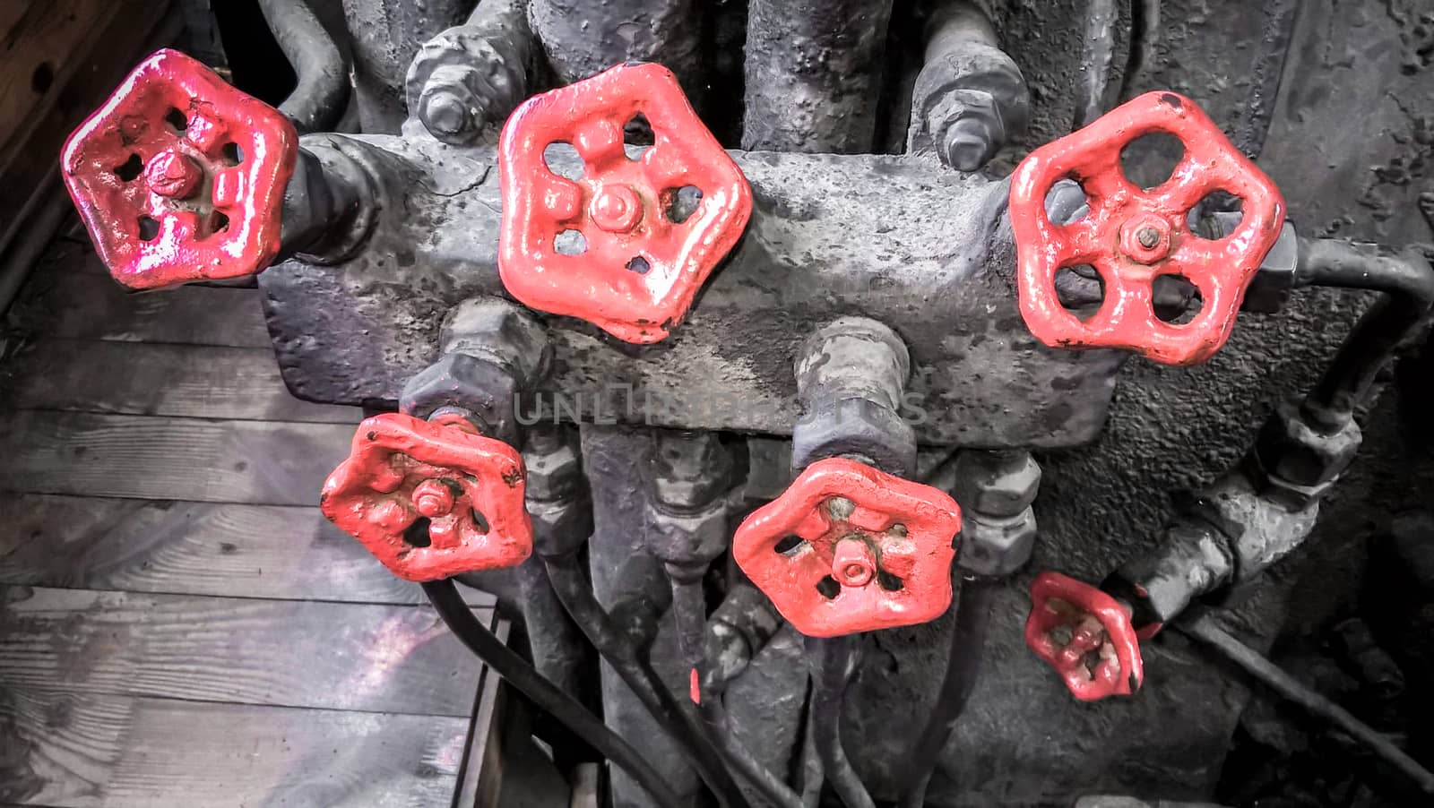 controls and valves in the cabin of an old steam locomotive