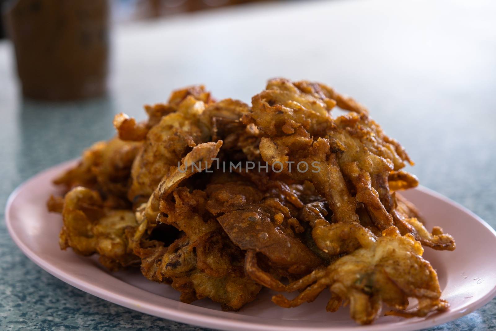 The Soft Shell Crab fried with garlic on plate in restaurant.