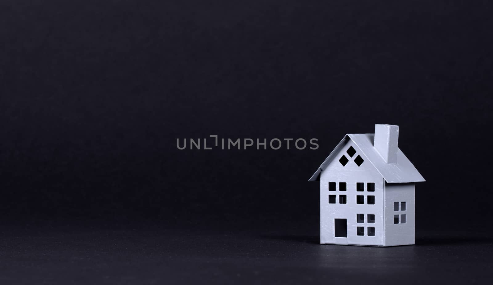 Estate concept, metal house on isolated on black background by michaklootwijk
