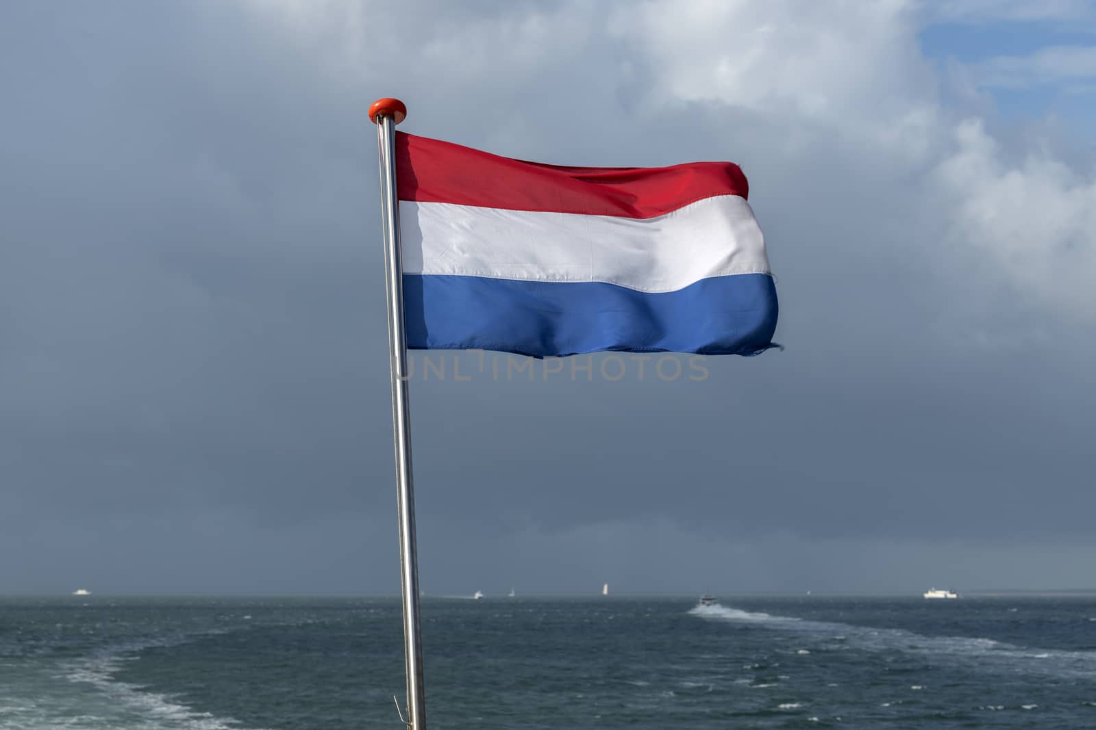 Wadden Sea with Dutch flag 
 by Tofotografie