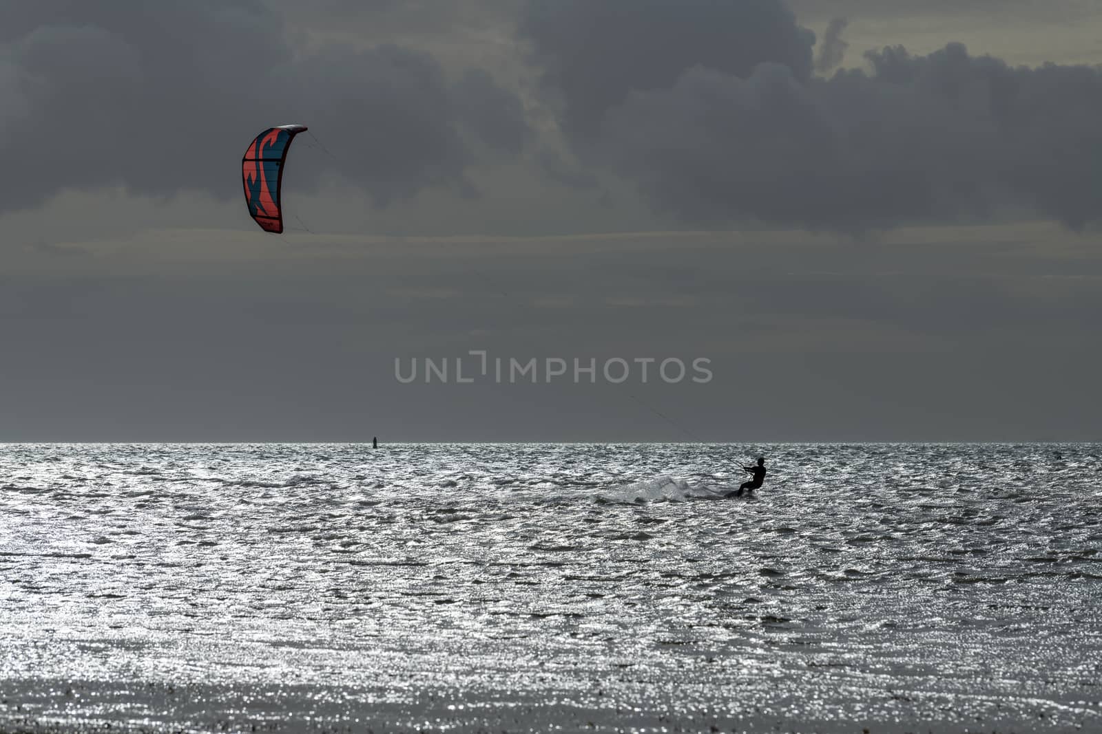 Kite Surfer in the evening sun on the Wadden Sea 
 by Tofotografie