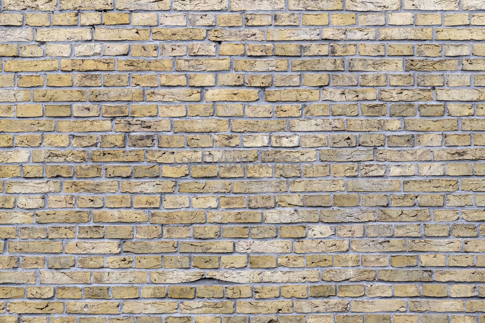 Background Photo of historic yellow brickwork in the North of the Netherlands 
