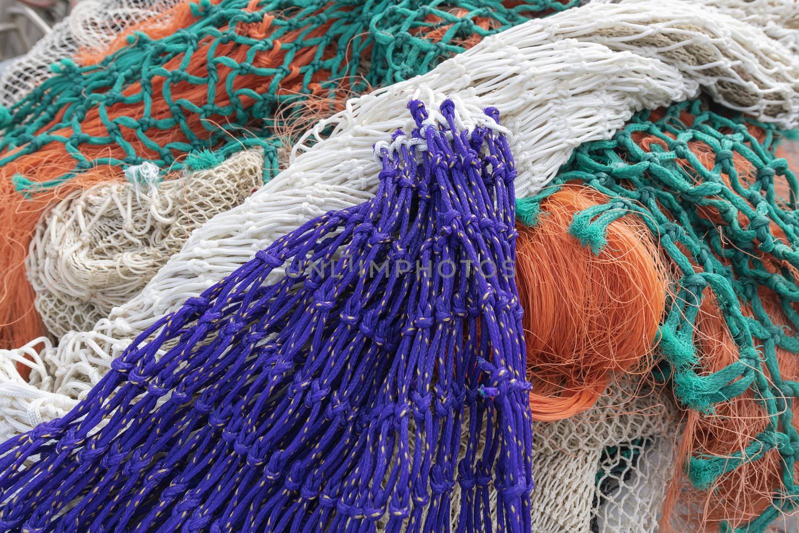 Multi colored fishing nets in a Dutch port in the North of the Netherlands
