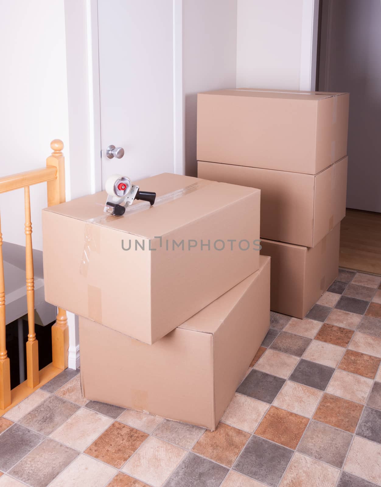 Stack of moving box in a house by lanalanglois