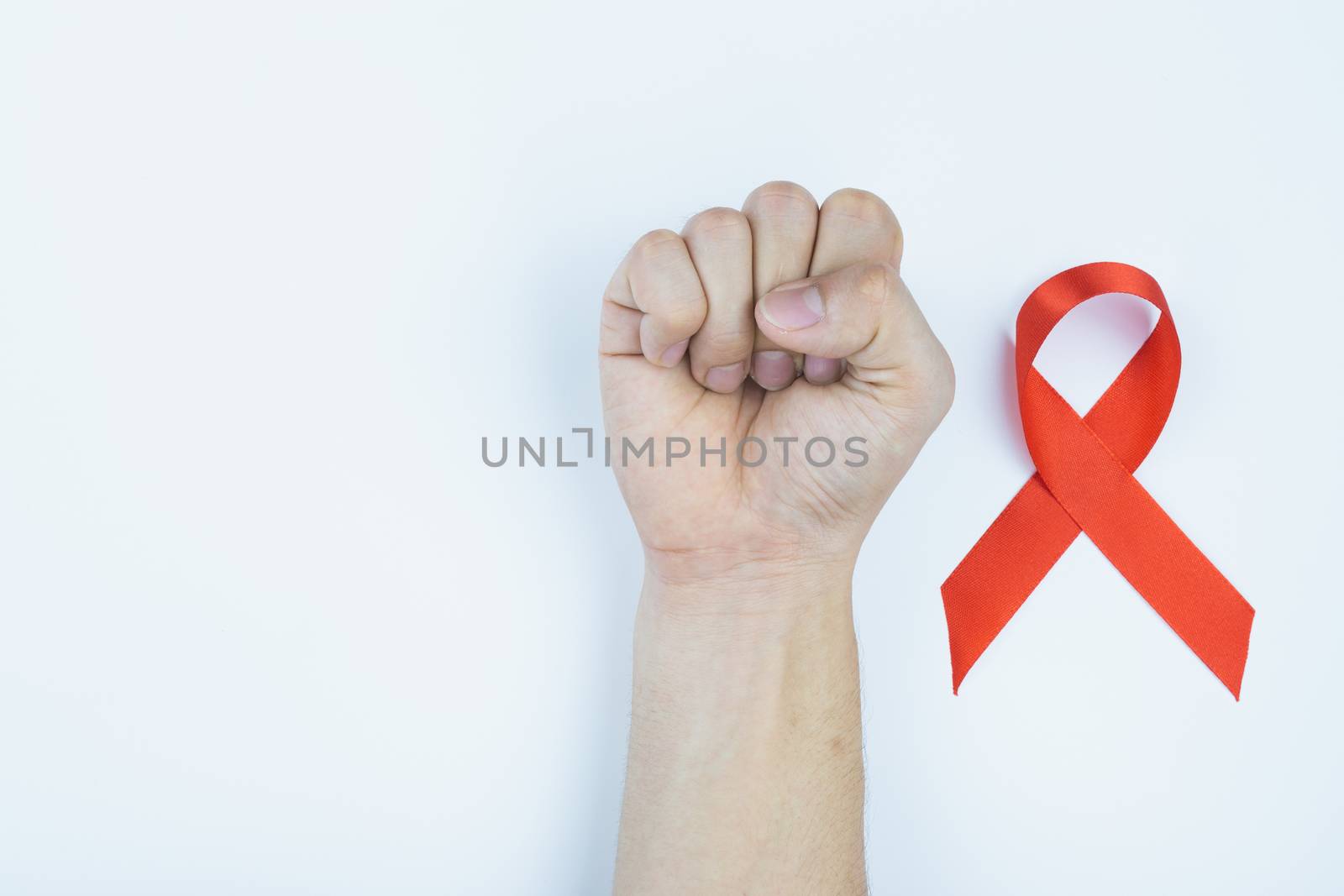 Aids awareness, male hands stranglehold and red AIDS awareness r by mikesaran