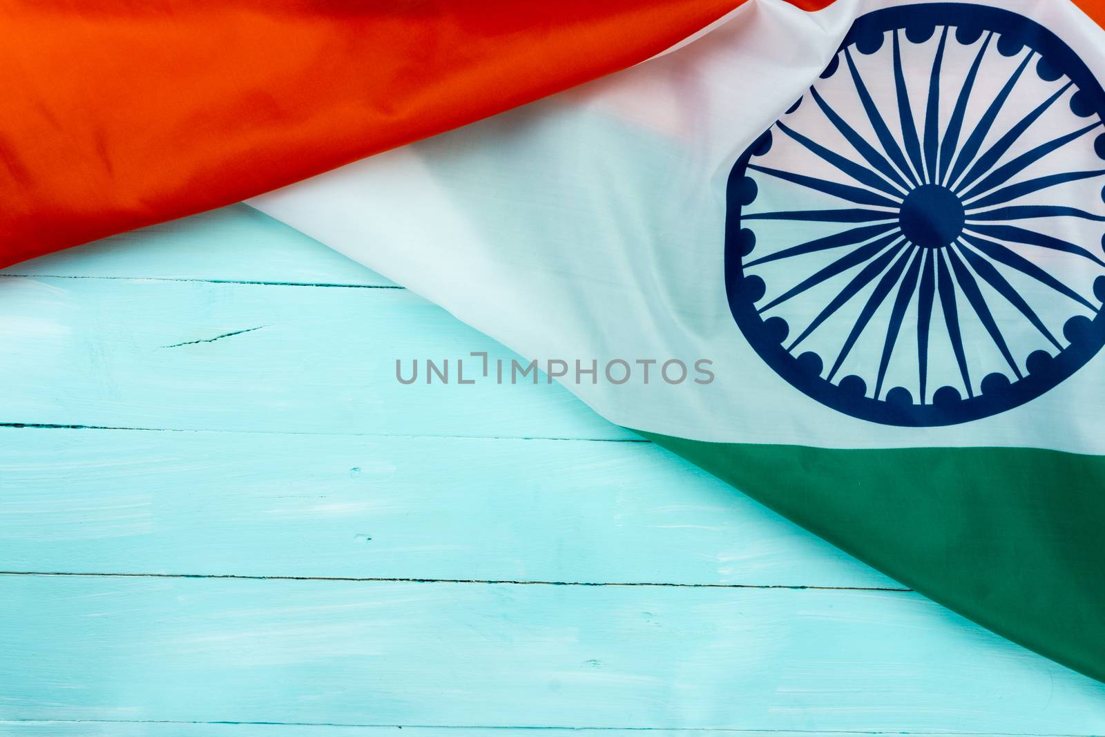 National flag of India on blue wooden background for Indian Independence day. Top view, copy space for text.