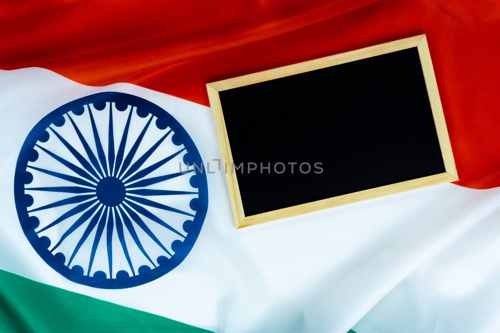 National flag of India with backboard on white background for Indian Independence day. Top view, copy space for text.