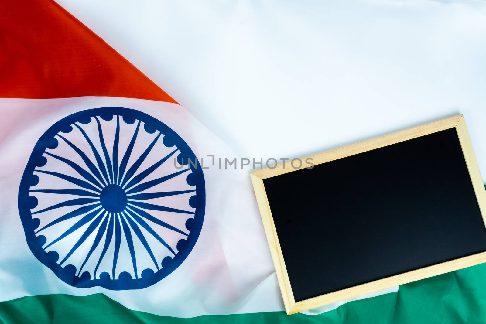 National flag of India with backboard on white background for Indian Independence day. Top view, copy space for text.