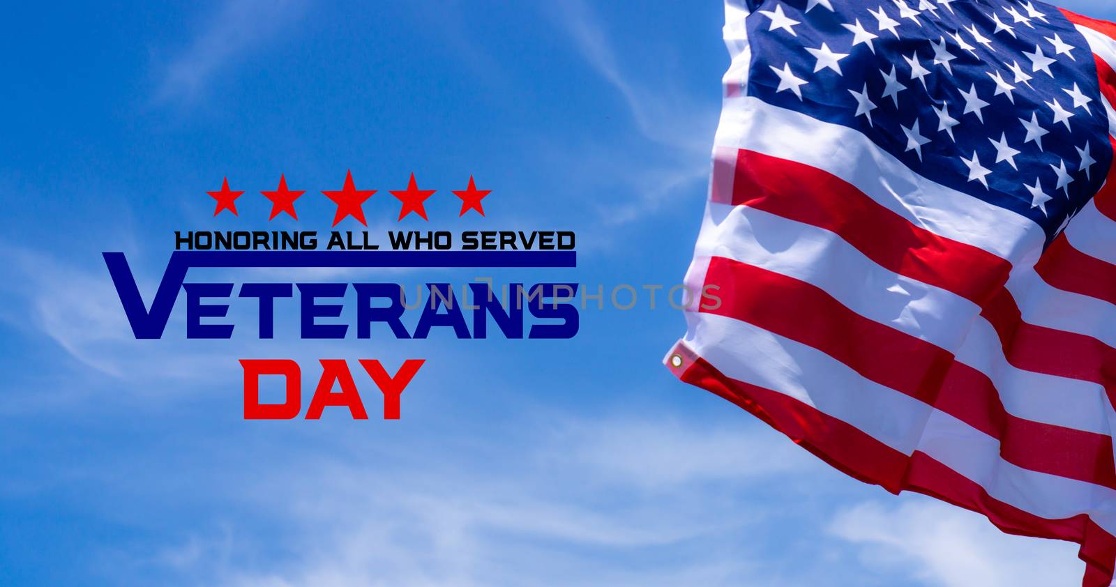 Happy Veterans Day with American flags on blue sky background.