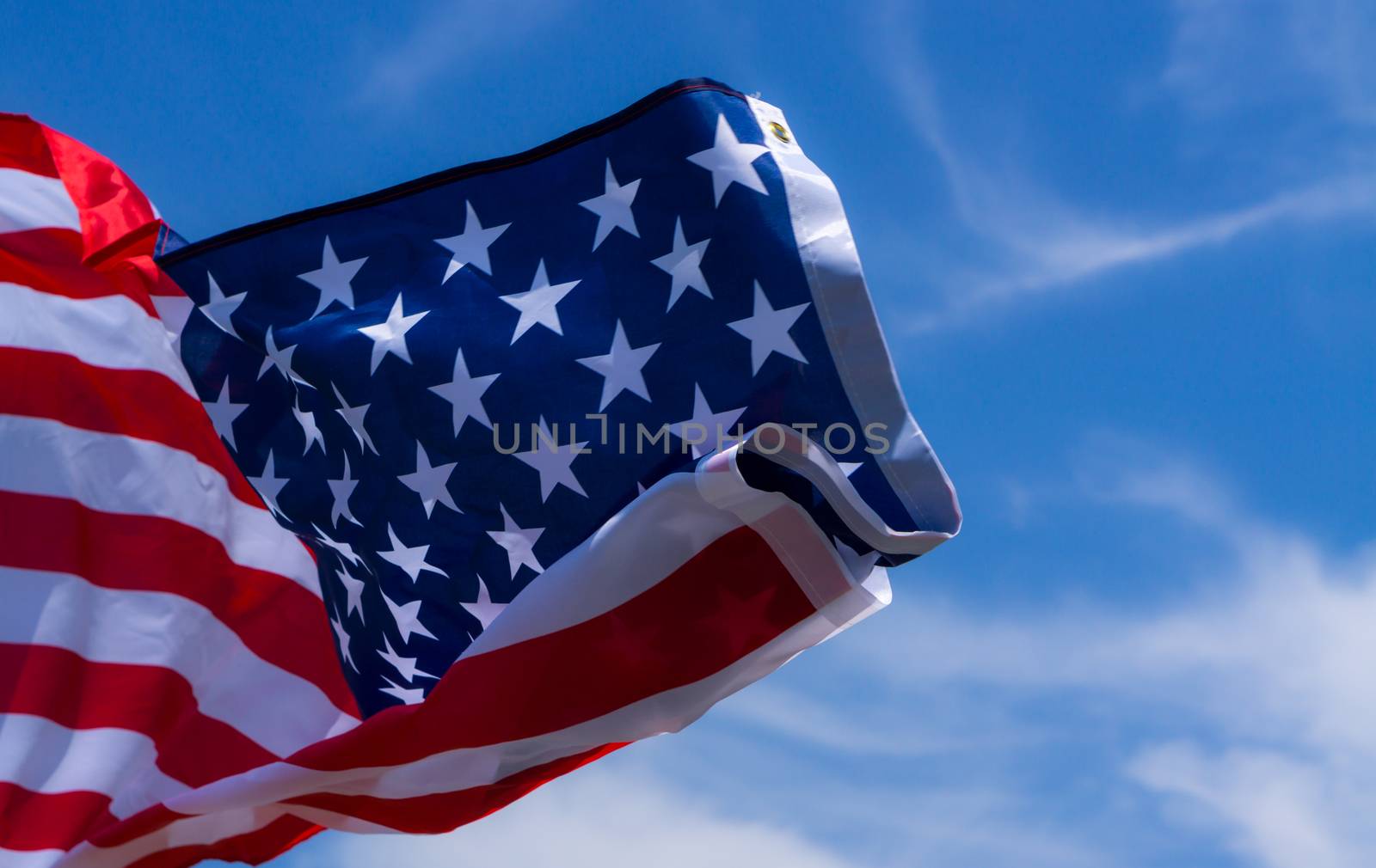 US American flag on blue sky background. For USA Memorial day, V by mikesaran