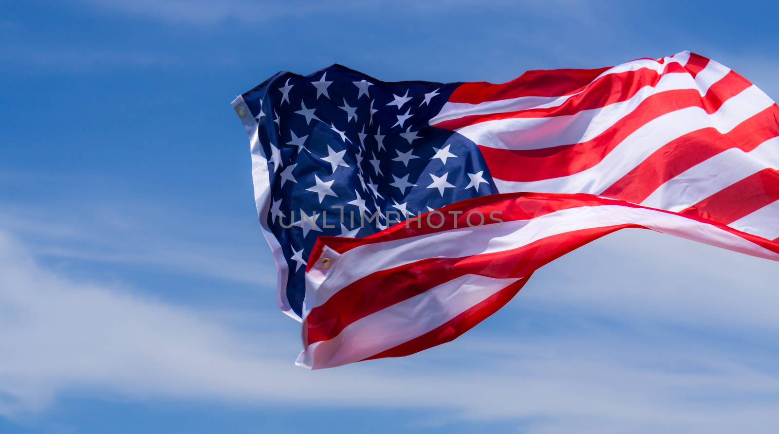 US American flag on blue sky background. For USA Memorial day, V by mikesaran