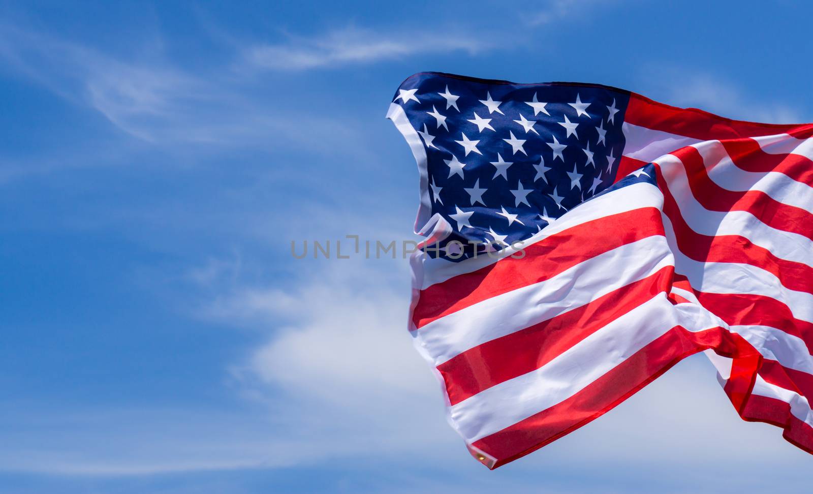 US American flag on blue sky background. For USA Memorial day, V by mikesaran