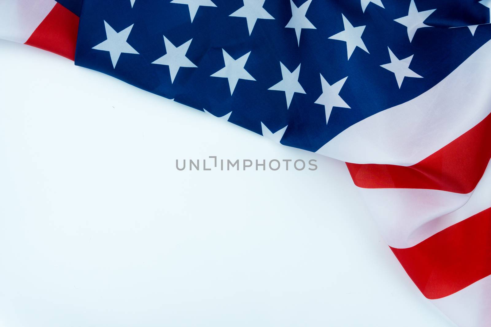 US American flag on white background. For USA Memorial day, Veterans day, Labor day, or 4th of July celebration. Top view, copy space for text.