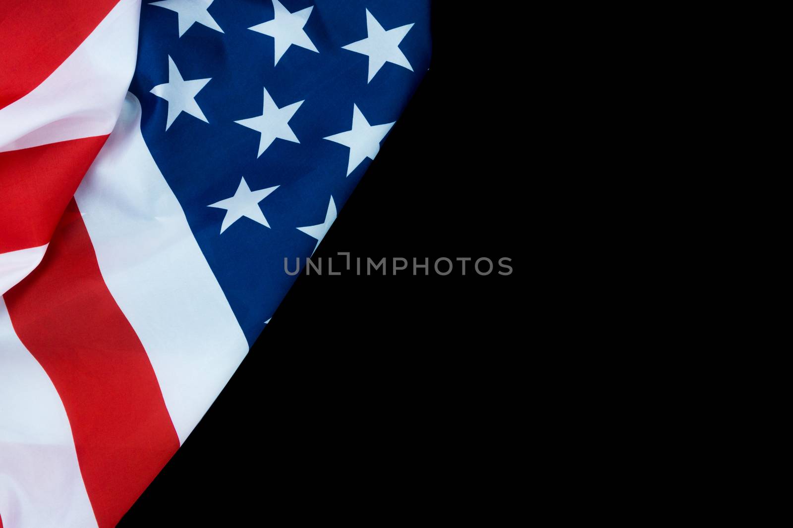 US American flag on black background. For USA Memorial day, Veterans day, Labor day, or 4th of July celebration. Top view, copy space for text.