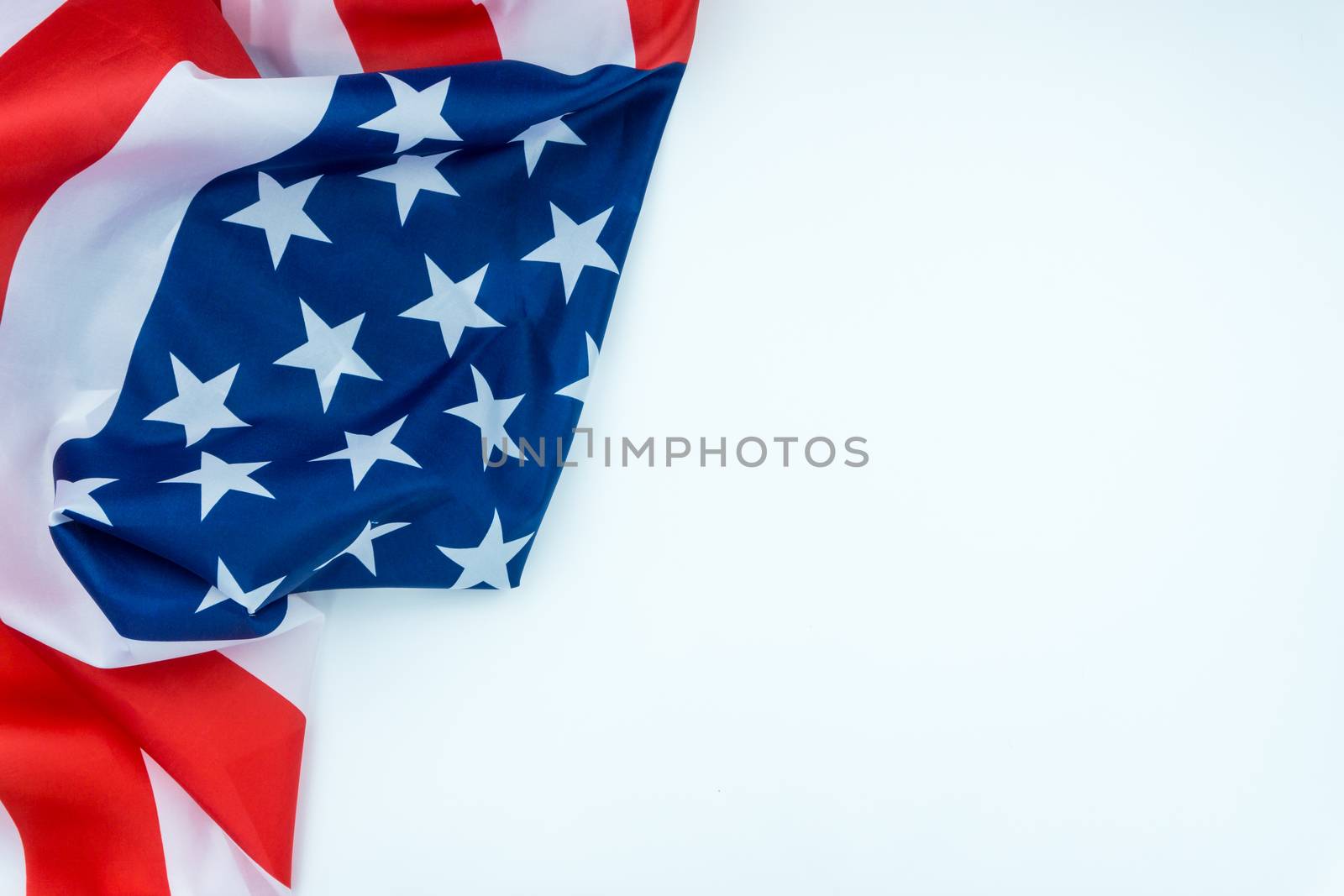 US American flag on white background. For USA Memorial day, Veterans day, Labor day, or 4th of July celebration. Top view, copy space for text.