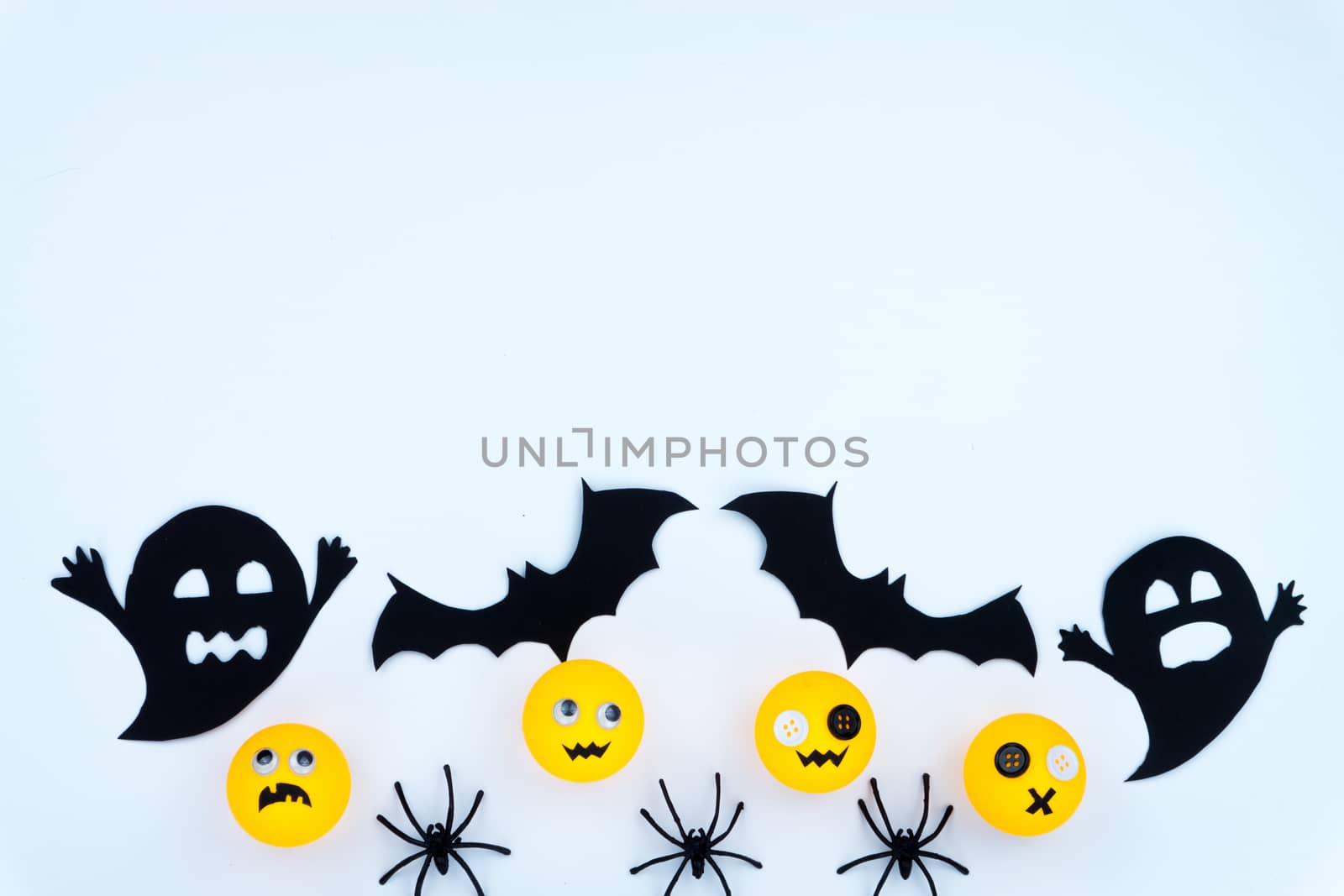 Top view of Halloween decoration, jack o lantern, ghost, bat and spider on white background with copy space for text. halloween concept.