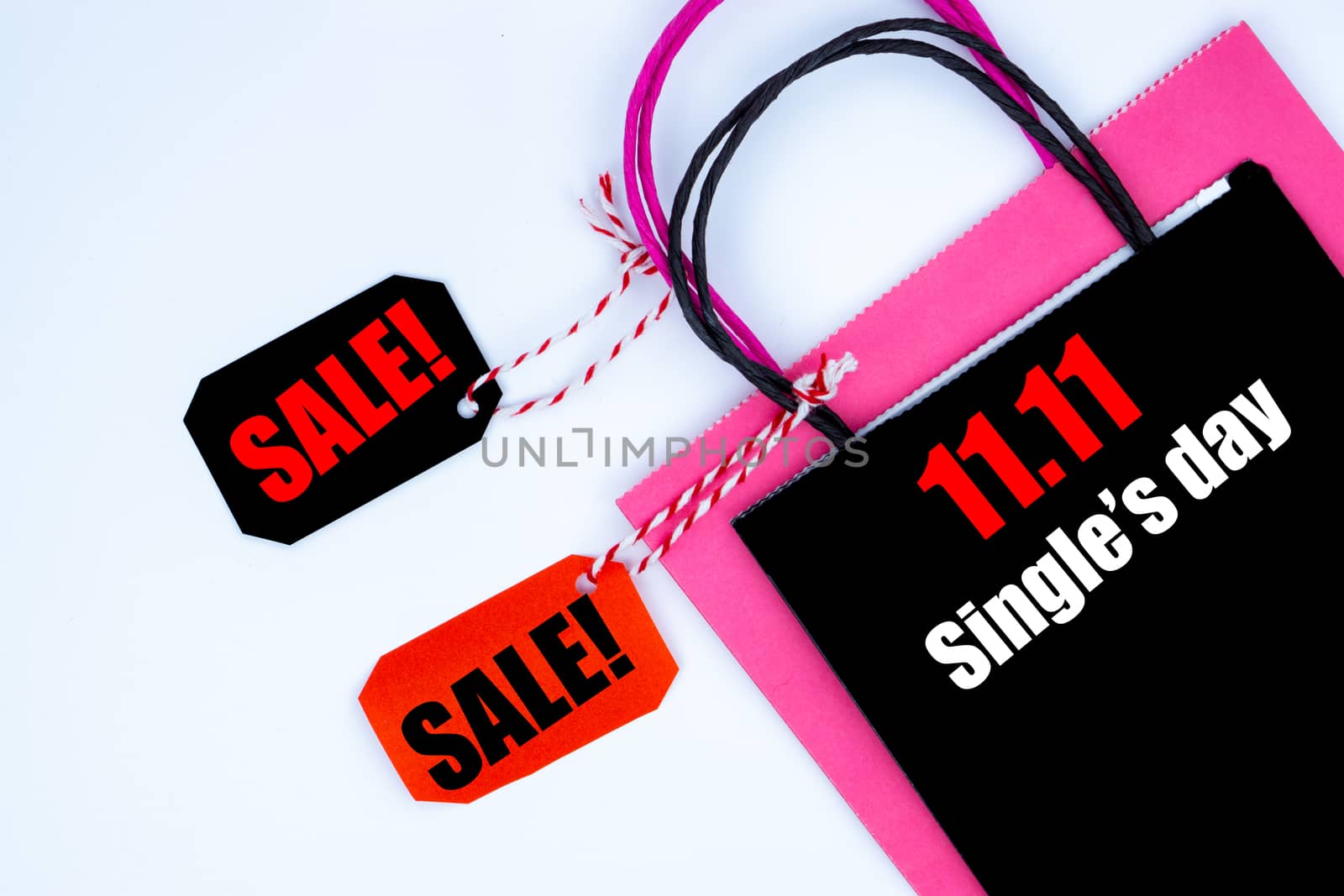 The shopping bag and tag sale on a white background with copy space for text.Online shopping of China, 11.11 single's day sale concept