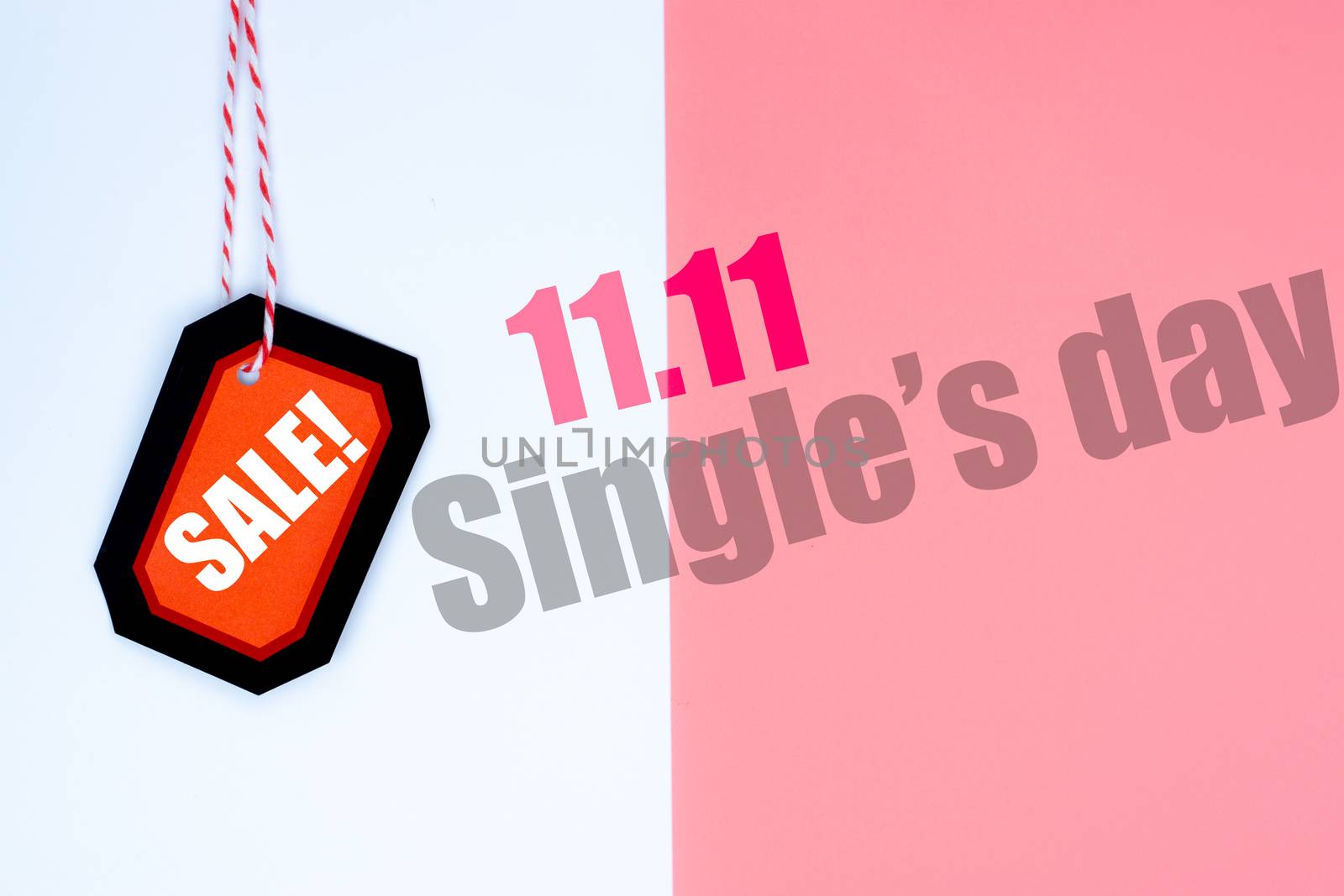 Online shopping of China, The red and black shopping tag with red rope on a white and pink background with copy space for text. 11.11 single's day sale concept
