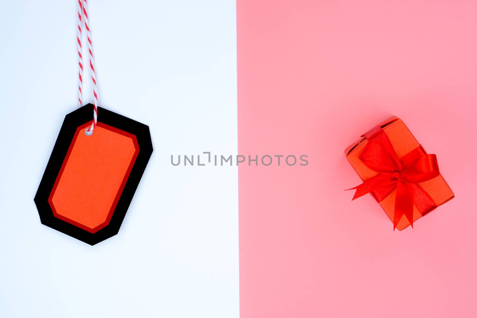 Online shopping of China, The shopping boxes with red rope and shopping tag on a white and pink background with copy space for text. 11.11 single's day sale concept