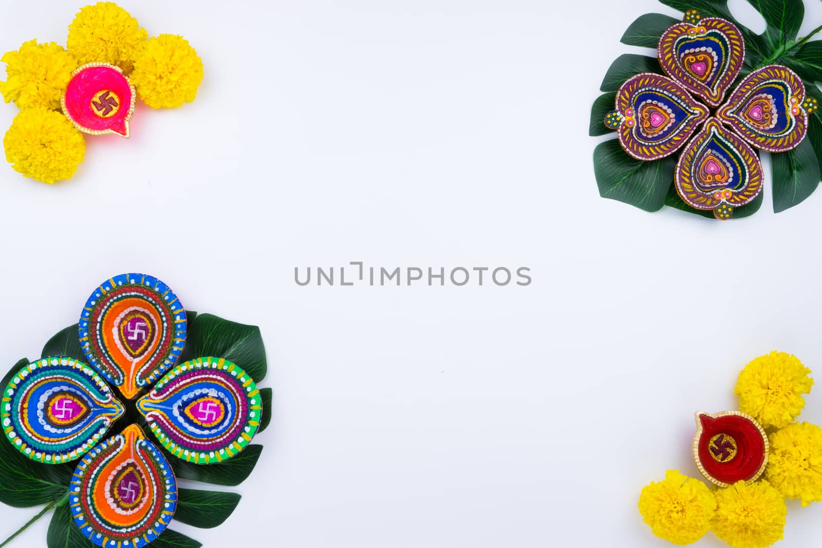 Indian festival Diwali, Diya oil lamps lit on colorful rangoli. Hindu traditional. Happy Deepavali. Copy space for text.