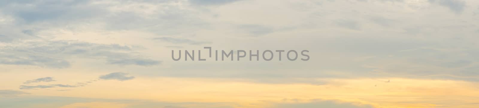 Panorama clear warm sky with white cloud background in the sunset time. warm light sky background.